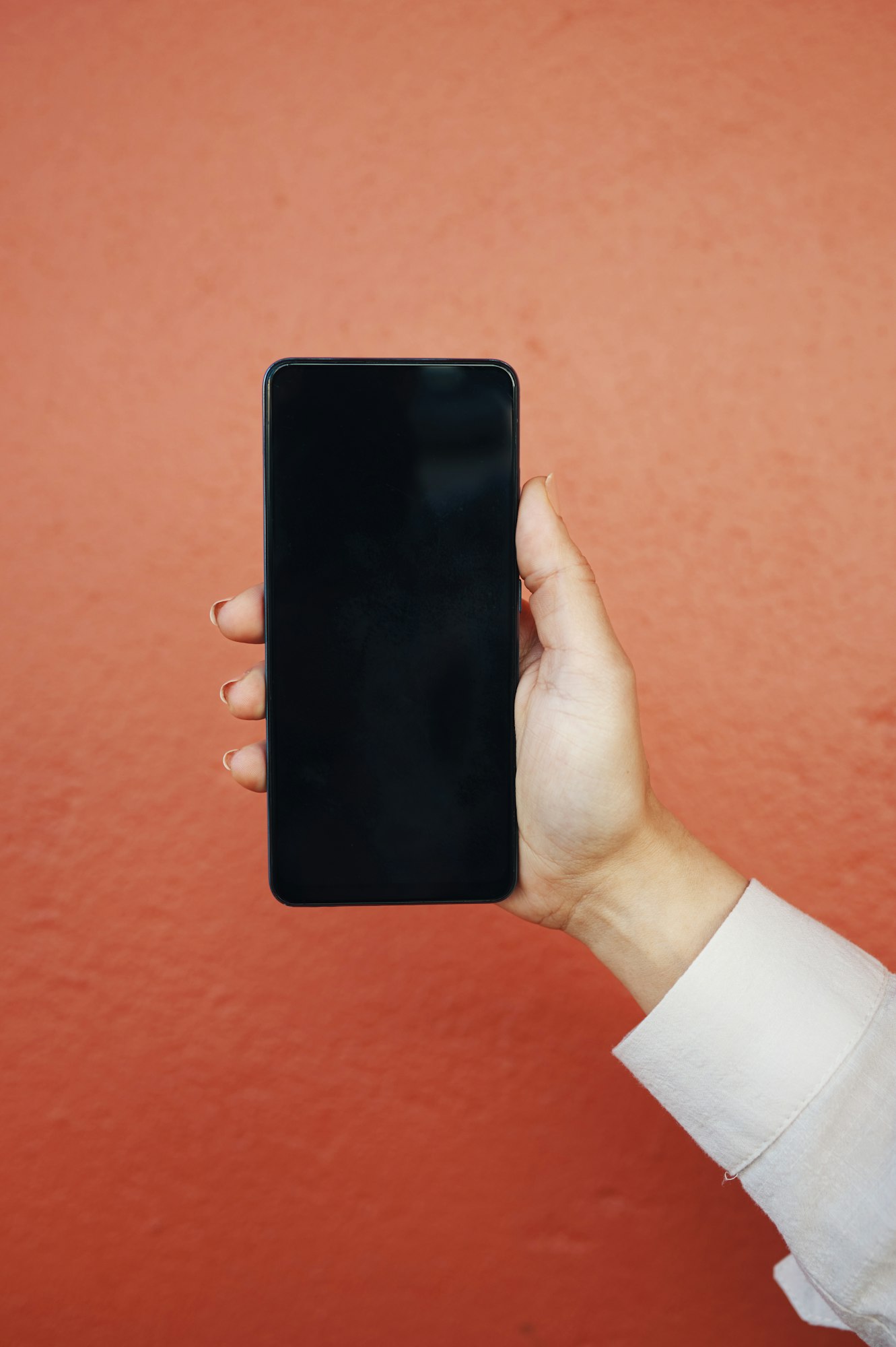 Phone screen, hand and woman in a city for travel, search or sign up, guide or location on orange b